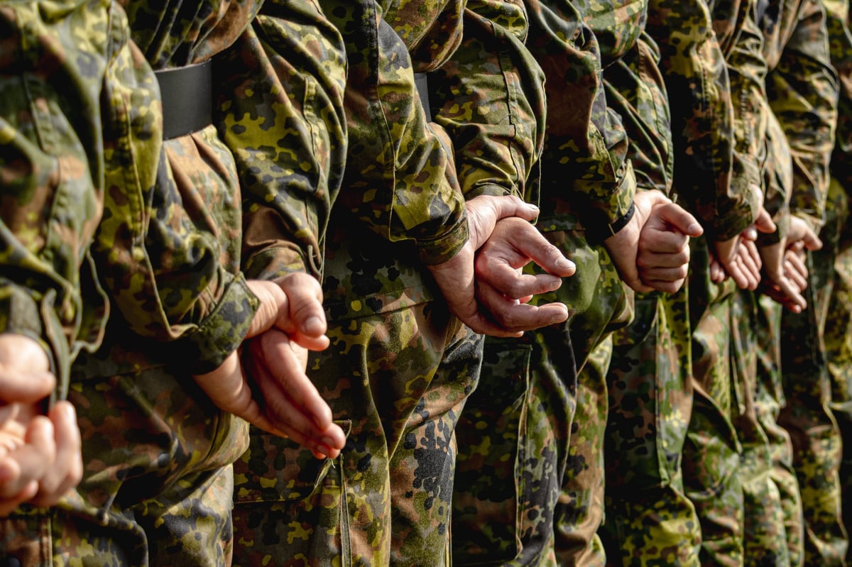 German Bundeswehr soldiers in combat uniforms standing in formation during military parade